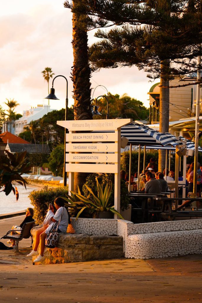 pexels-photo-32794723 Cozy beachfront dining scene at sunset with people enjoying the view at Watsons Bay.